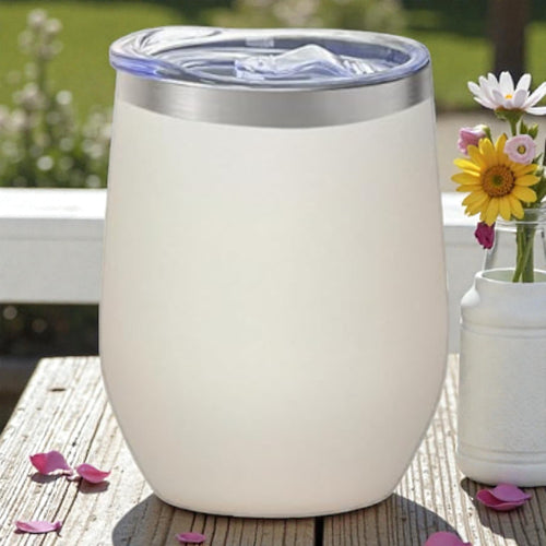 White insulated tumbler with a silver rim on a white background